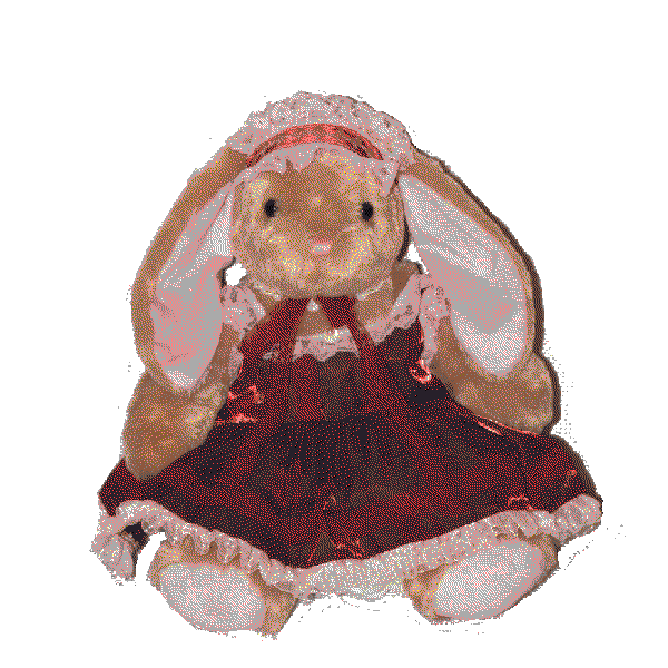 stuffed animal bunny in a shiny red dress with pink lace and a headdress